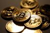 A pile of coins representing Bitcoin cryptocurrency sit grouped together in this arranged photograph in London, U.K., on Wednesday, Feb. 7, 2018. Cryptocurrencies tracked by Coinmarketcap.com have lost more than $500 billion of market value since early January as governments clamped down, credit-card issuers halted purchases and investors grew increasingly concerned that last year�s meteoric rise in digital assets was unjustified.