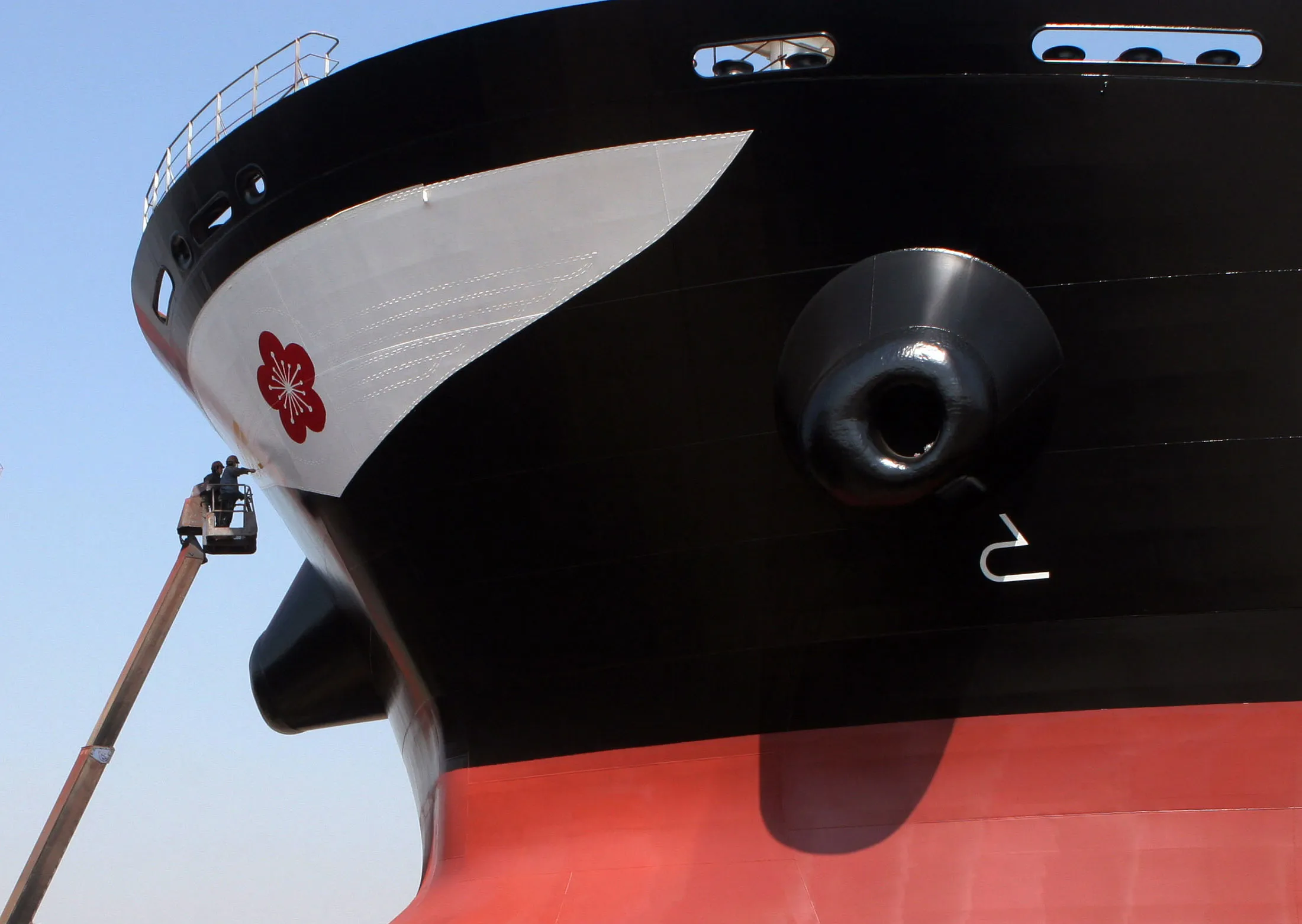 Chinese workers have the finished touch on a 175,000dwt Capesize bulk Carrier at a dry dock.
