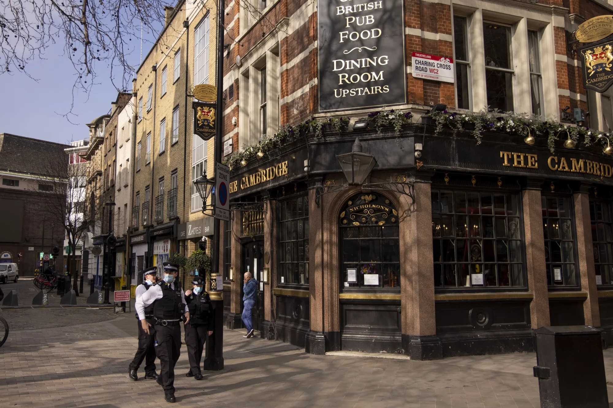 Police officers stand outside a closed pub in the West End in London&nbsp;on&nbsp;March 1.&nbsp;