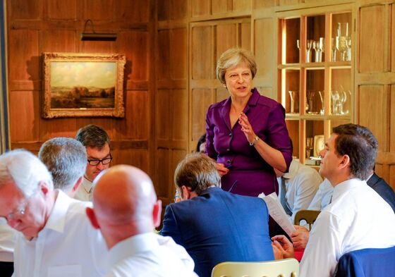 May Tames Divided Tories as Business Cheers Soft Brexit Plan