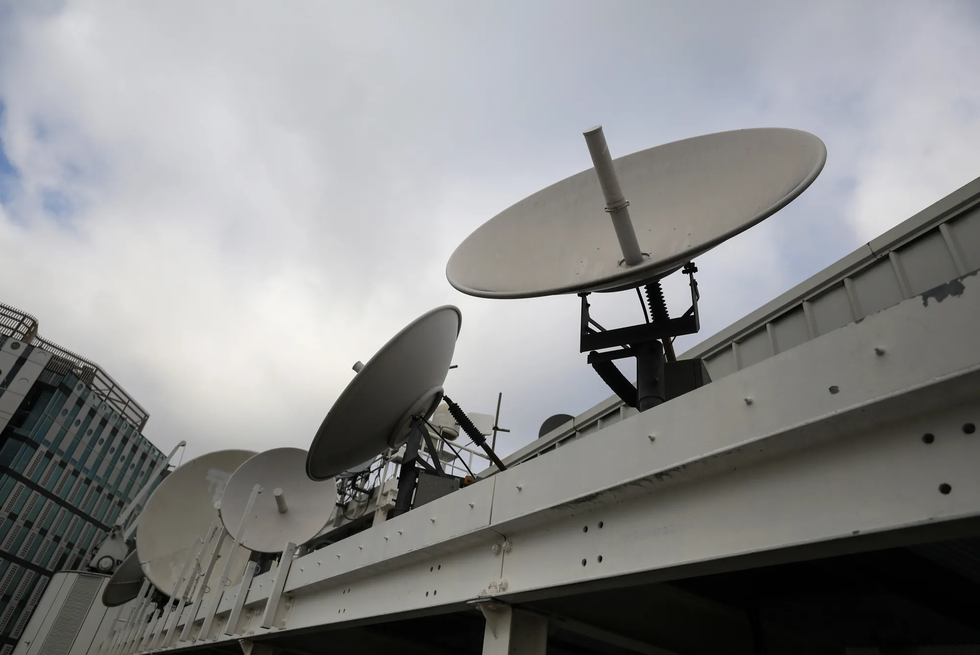 Satellite dishes on the roof at Inmarsat Plc's headquarters in London.