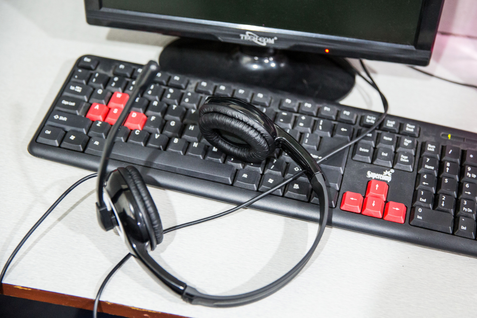 A headset on a keyboard at a call center.