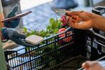 A customer pays at Pike Place Market in Seattle.