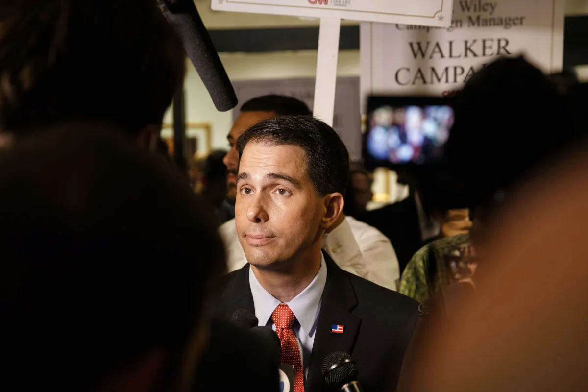 Scott Walker, governor of Wisconsin and 2016 Republican presidential candidate, speaks to the media in the spin room after the Republican presidential debate at the Ronald Reagan Presidential Library in Simi Valley, California, U.S., on Wednesday, Sept. 16, 2015. The main debate of the top 11 GOP contenders in the polls follows the "kids' table" debate of candidates who didn't make the cut.

