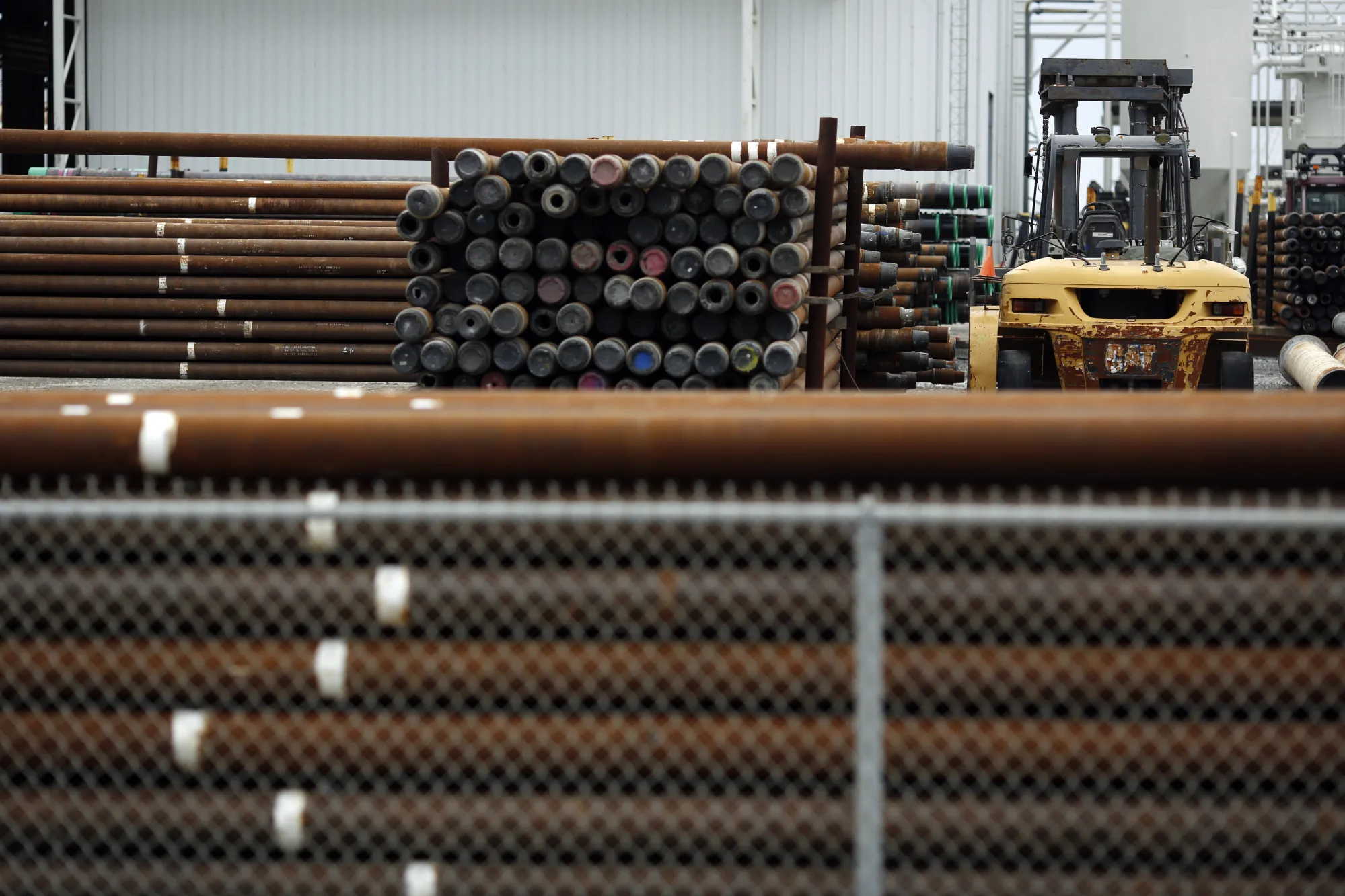 Petroleum industry drilling pipes stacked in Port Fourchon, Louisiana.