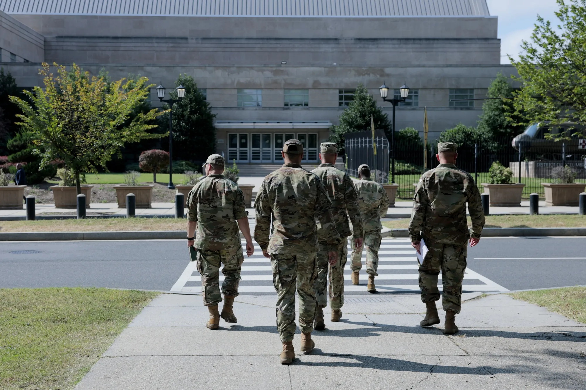 Members of the National Guard arrive at the Guard’s headquarters at the DC Armory&nbsp;in Washington.