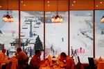 Diners eat overlooking the indoor ski slope at the Mall of the Emirates in Dubai.