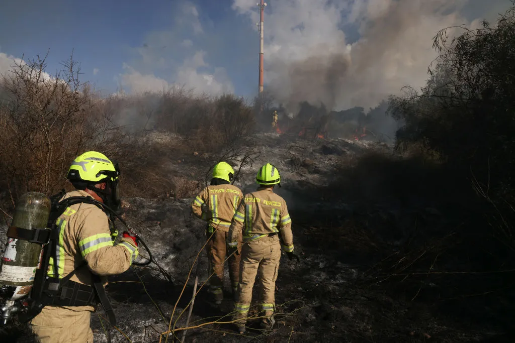 Responders put out a fire in the area of Lod, near Tel Aviv, in central Israel on Sept. 15.
