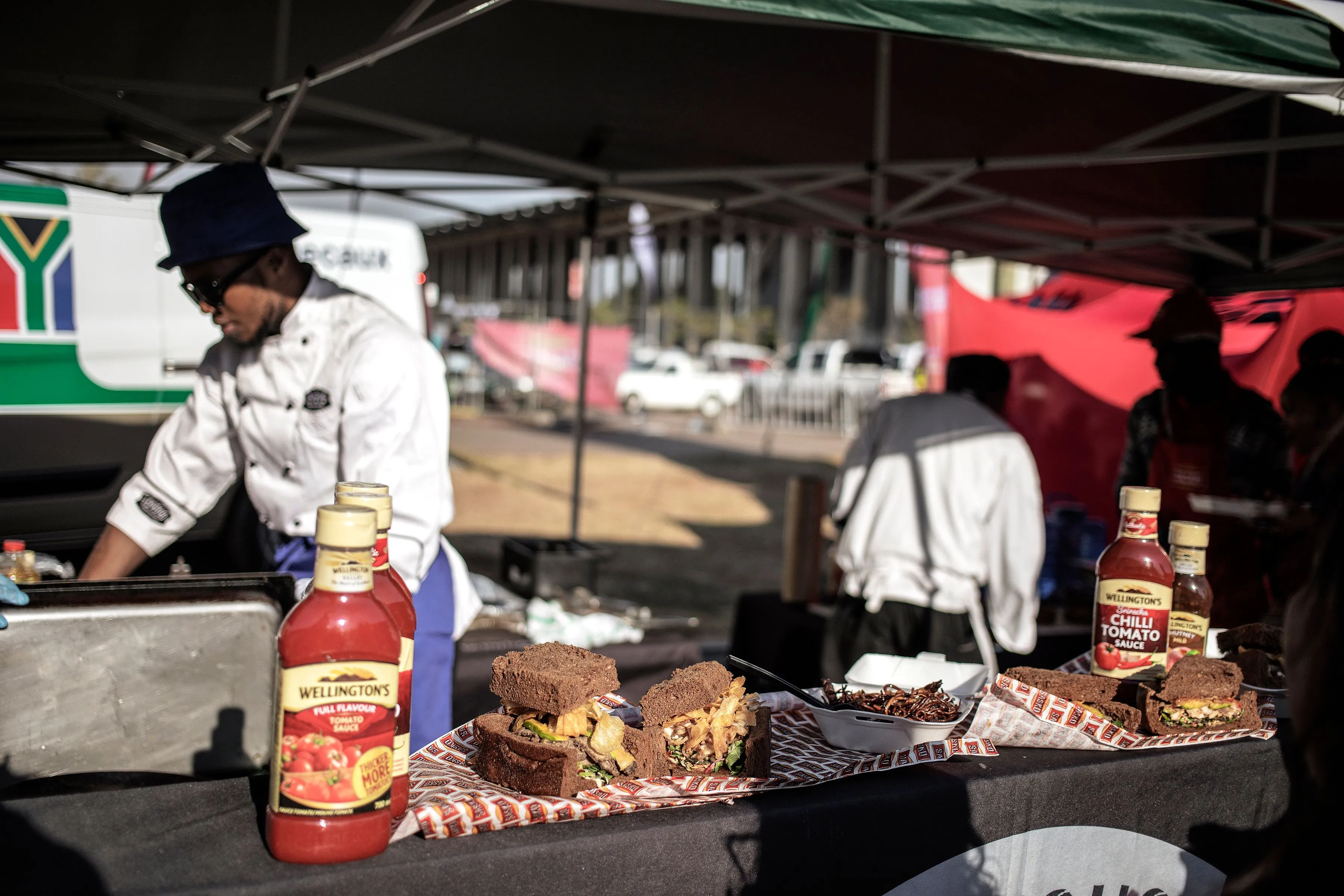 A street vendor prepares a 'Kota' sandwich during the Kota Festival at Kliptown in Soweto, South Africa.