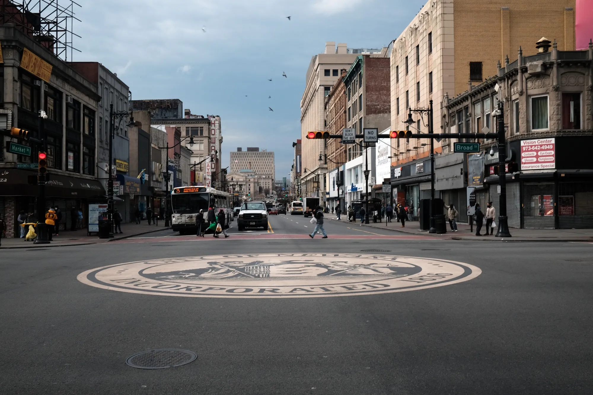 People walk through downtown Newark as the city experiences a rise in Covid-19 cases on November 25, 2020 in Newark, New Jersey.&nbsp;