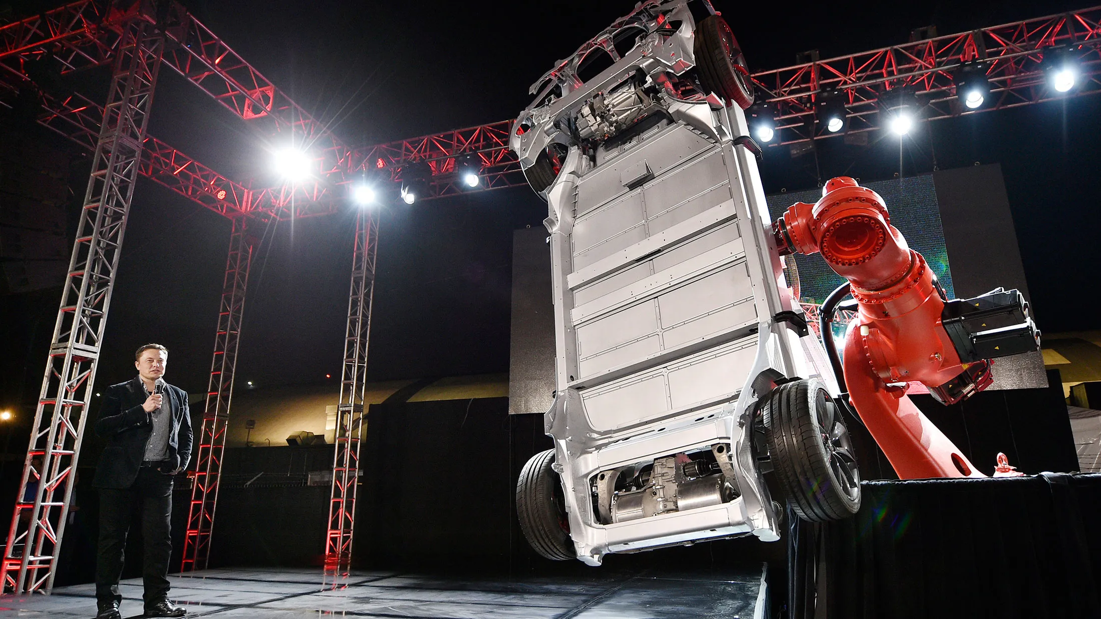 Elon Musk, CEO of Tesla, unveils the dual engine chassis of the new Tesla 'D' model at the Hawthorne Airport on Oct. 9, 2014 in Hawthorne, California.
