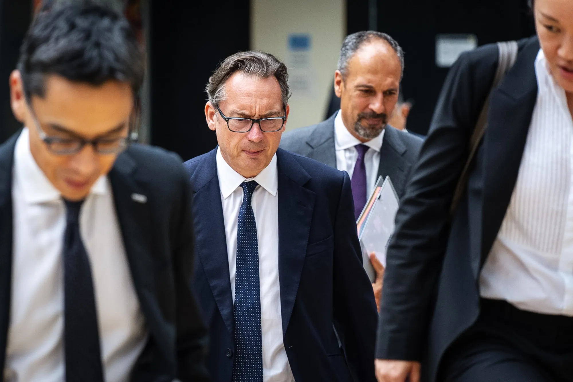 Simon Sadler leaves the District Court in Hong Kong.