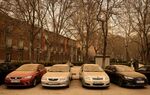 A line of parked vehicles covered with red Saharan dust in Madrid, on March 15.