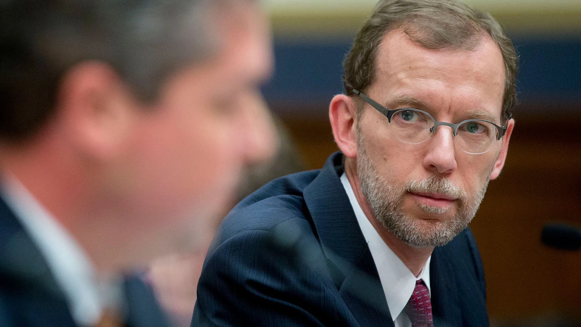 Douglas Elmendorf, director of the Congressional Budget Office (CBO), right, looks on as Osvaldo Gratacos, inspector general of the U.S. Export-Import (Ex-Im) Bank, speaks during a House Financial Services Committee hearing on the Ex-Im Bank reauthorization in Washington, D.C., U.S., on Wednesday, June 25, 2014
