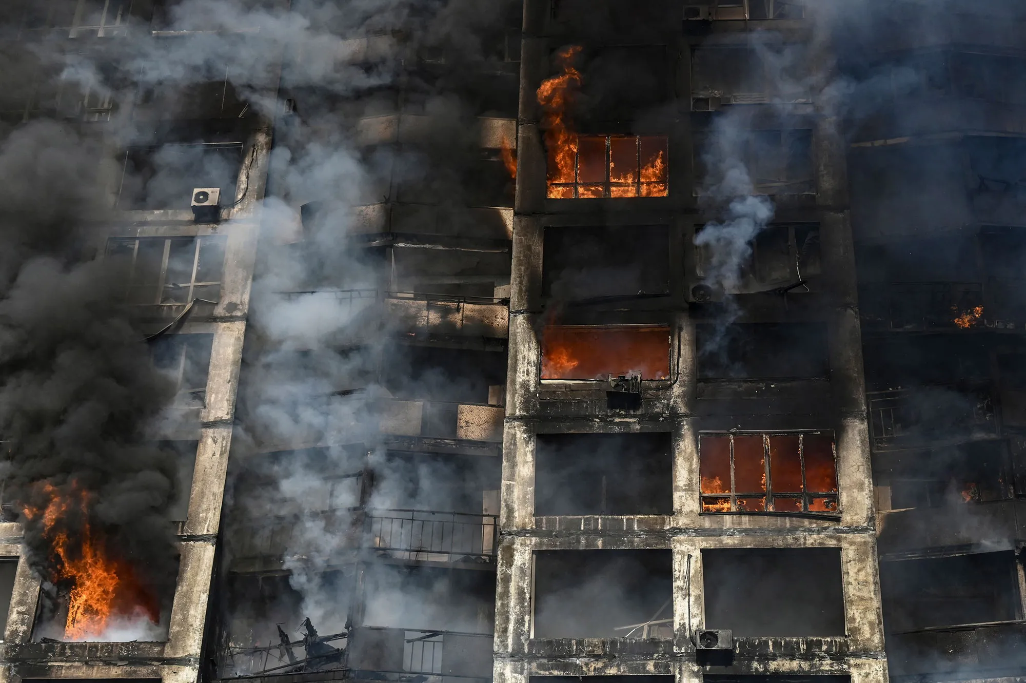 Firefighters extinguish a fire in an apartment building in Kyiv on March 15.