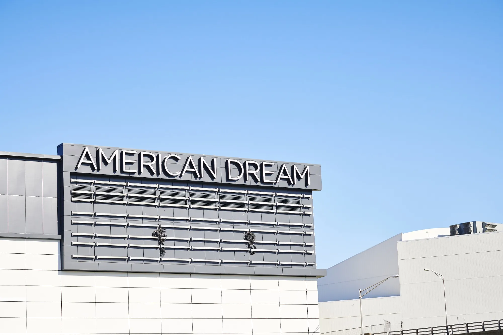 Signage stands outside the American Dream complex in East Rutherford, New Jersey, U.S., on Thursday, Aug. 29, 2019.&nbsp;