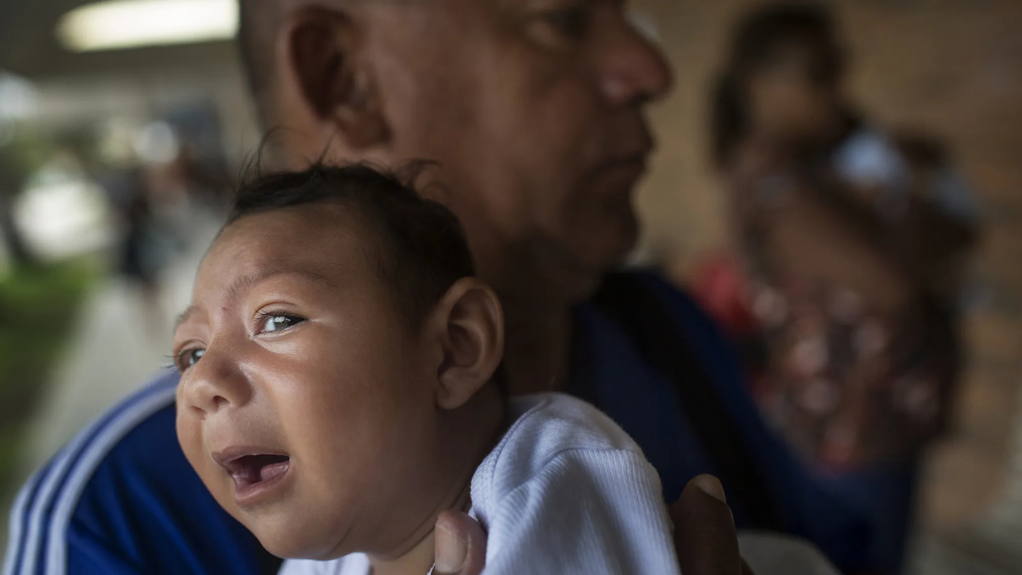 A man holds his one-month-old daughter at the AACD Hospital in Recife, Brazil.
