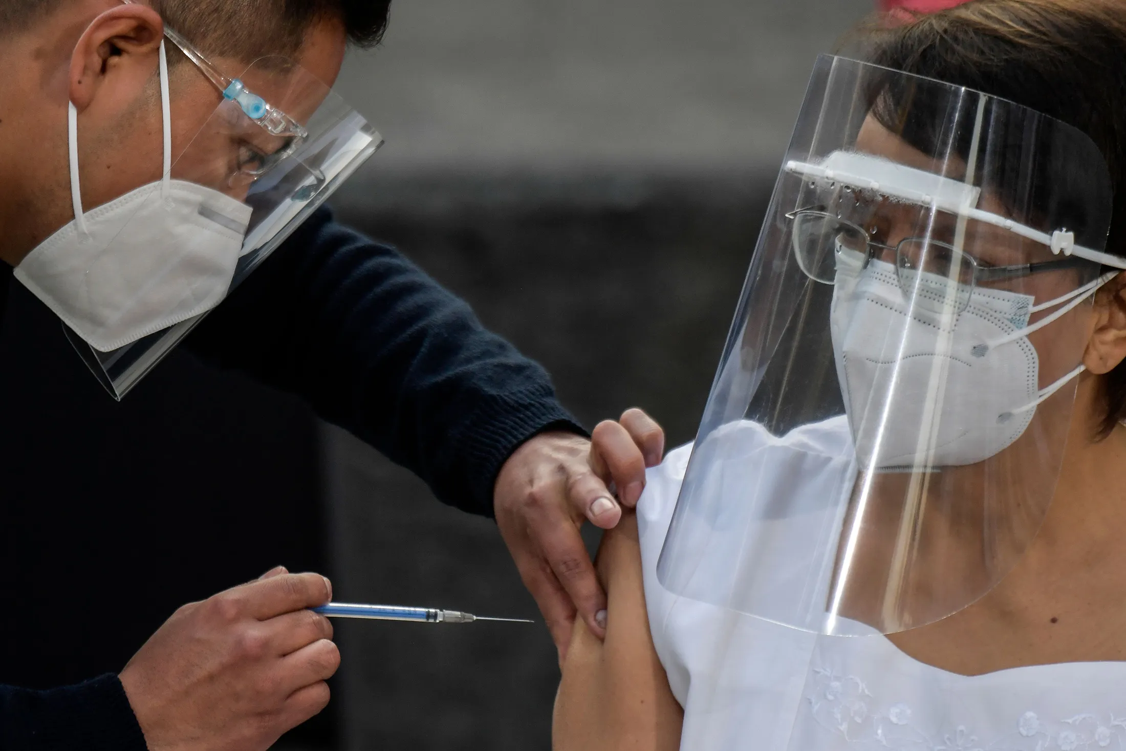 A nurse receives the coronavirus vaccine at the General Hospital in Mexico City, on Dec. 24.