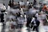 Pedestrians cross a road in Tokyo, Japan, on Tuesday, July 9, 2019. Japan’s wages dropped for a fifth month, according to Japan's Ministry of Health, Labour and Welfare, adding to concerns over the resilience of consumer spending as a sales tax increase approaches in October.