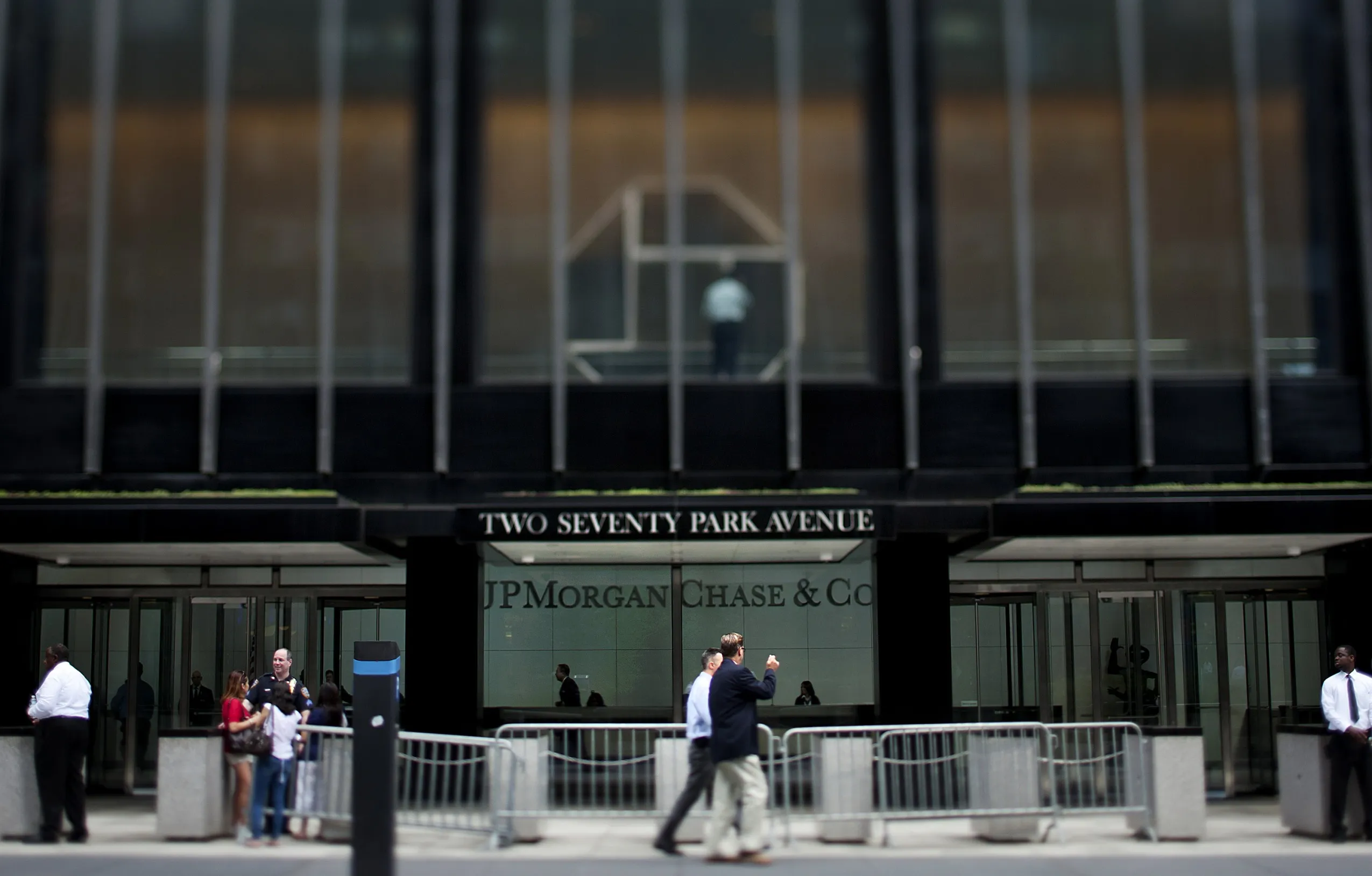 Pedestrians pass in front of the JPMorgan Chase &amp; Co. headquarters in New York.