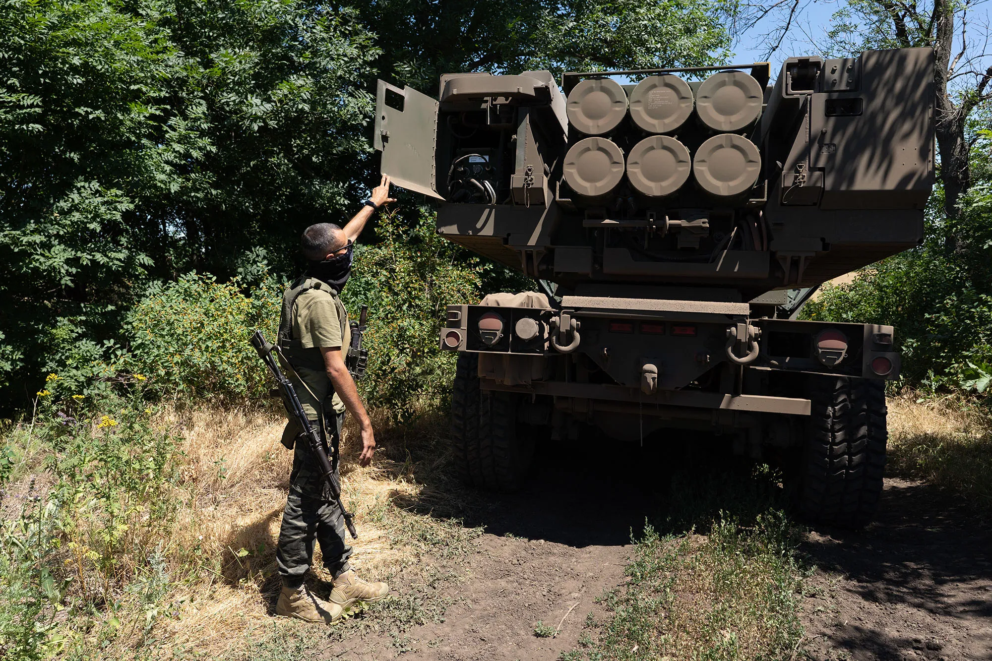 A Ukrainian soldier inspects a HIMARS vehicle in Eastern Ukraine on July 1.