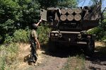 A Ukrainian soldier inspects a HIMARS vehicle in Eastern Ukraine on July 1.