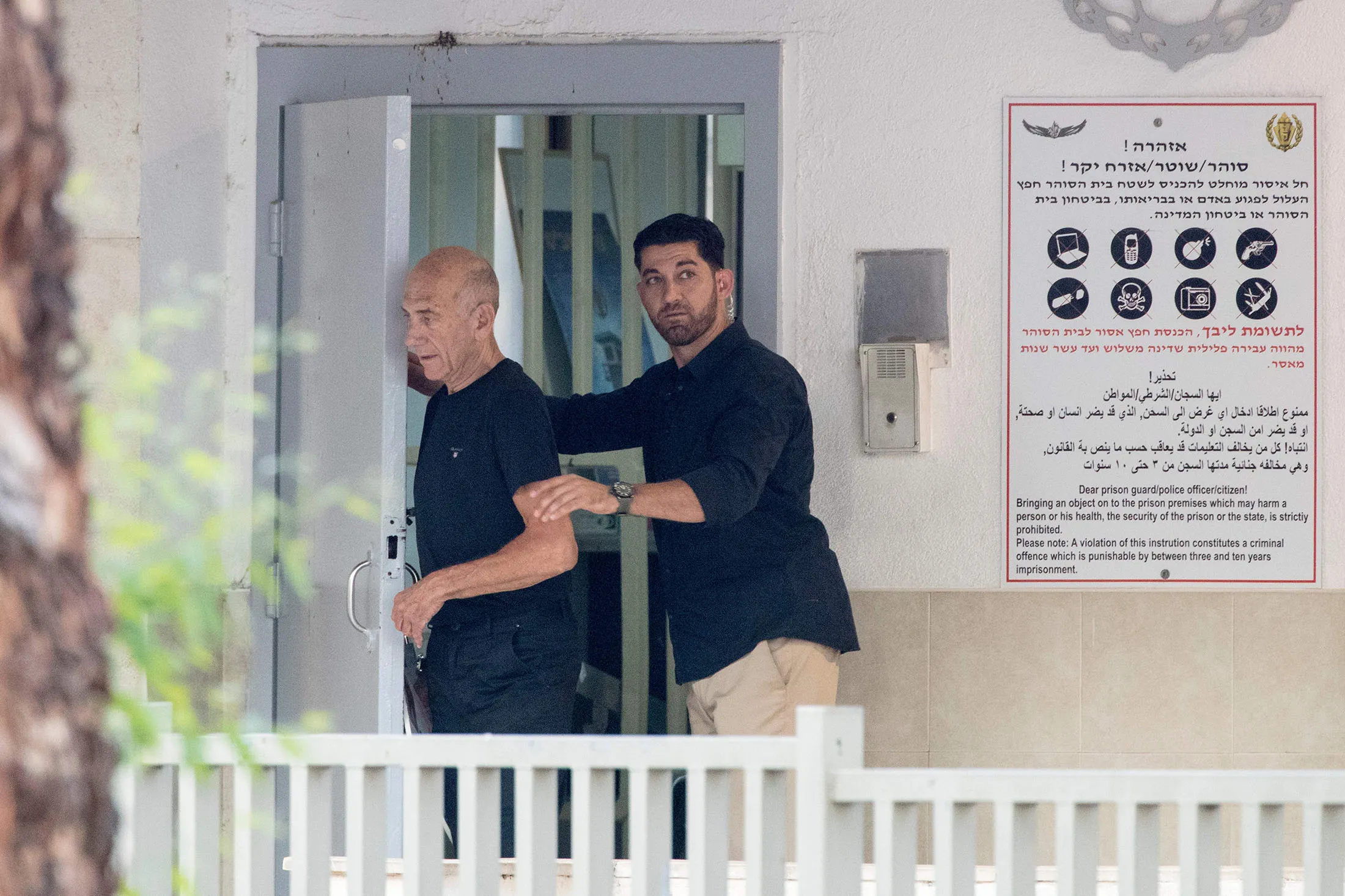 Former Israeli Prime Minister Ehud Olmert, left,, leaves the Maasyahu prison, on July 2, 2017 in Ramla.
