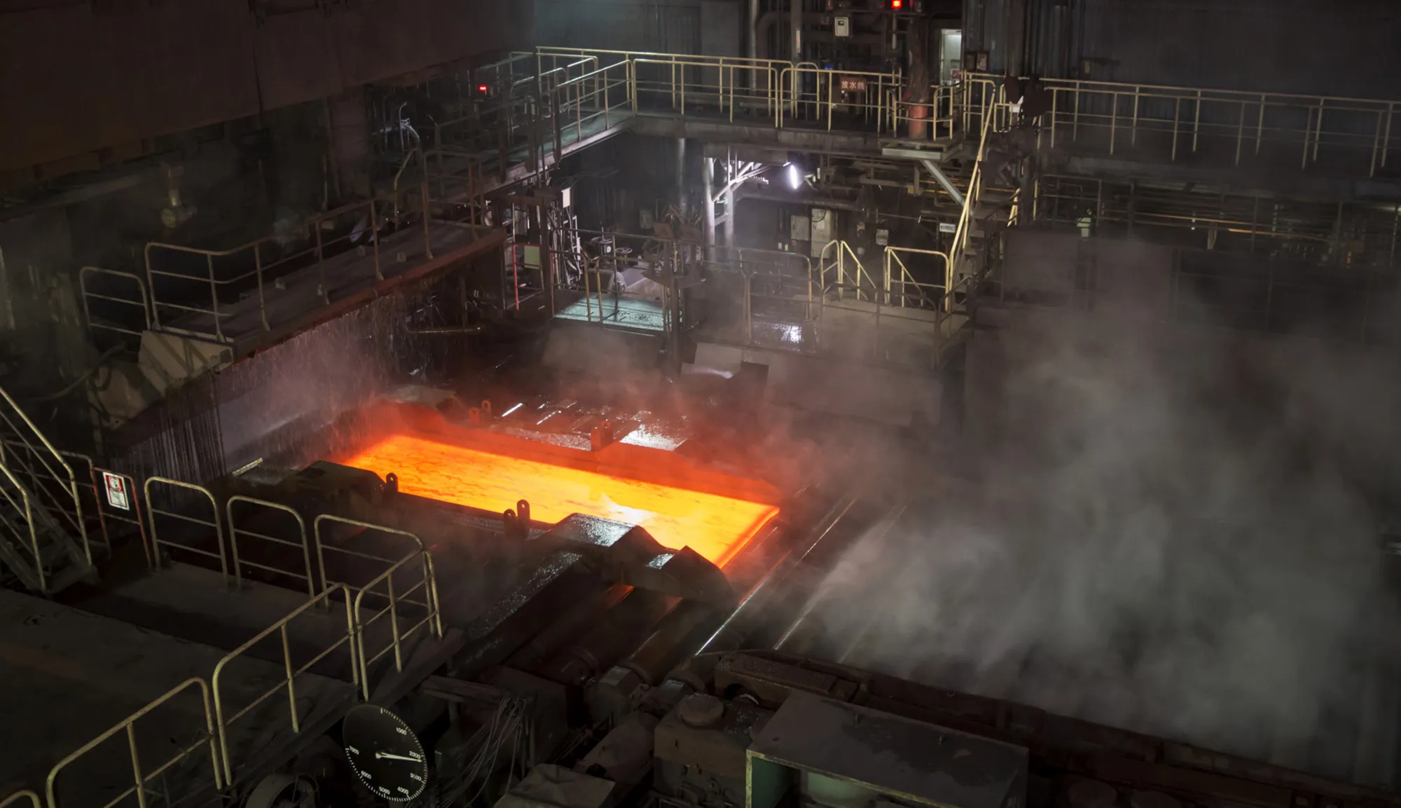 A hot steel slab moves along a conveyor at a factory&nbsp;in Kashima, Ibaraki, Japan.