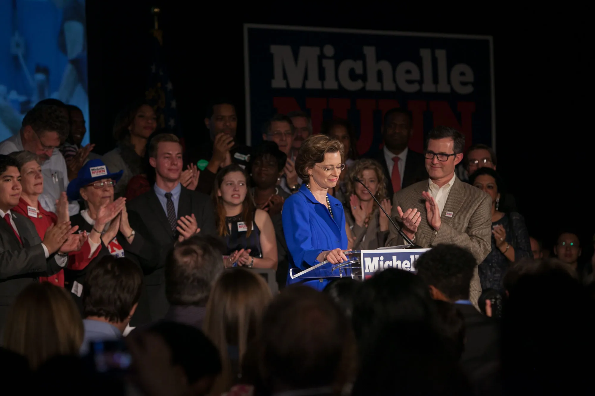 Georgia Democratic U.S. Senate candidate Michelle Nunn with husband, Ron Martin (right), makes a concession speech to supporters gathered at the Hyatt Regency in downtown Atlanta on November 4, 2014
