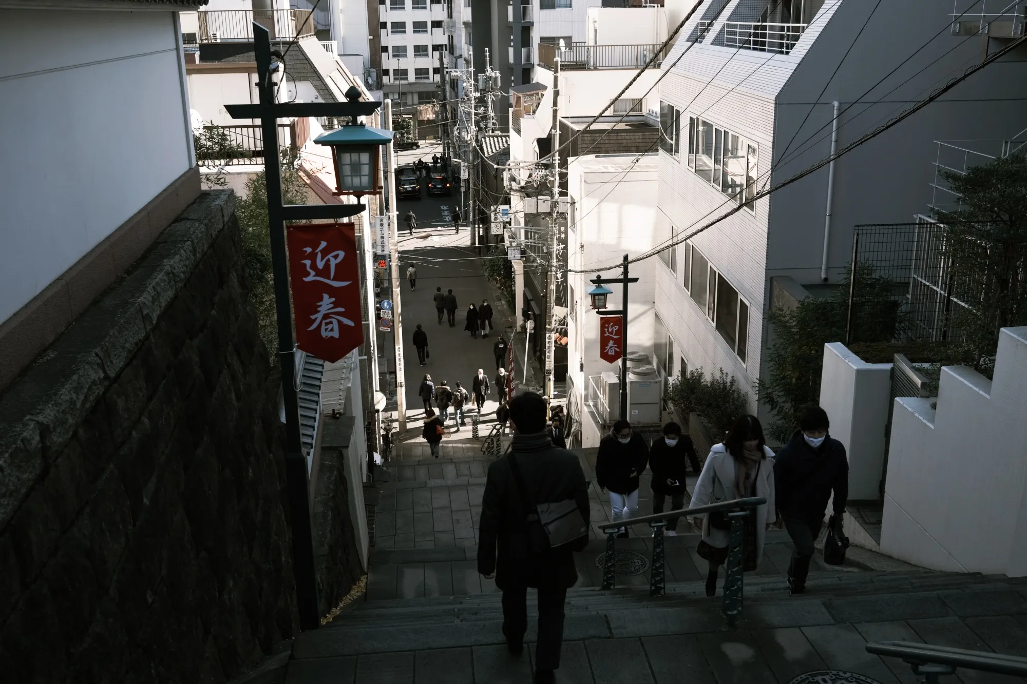 Visitors walk on a flight of stairs near the Kanda Myojin shrine on the first business day of the year in Tokyo, on Jan. 4..