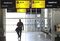 A volunteer passenger walks past departure gates during a test day ahead of opening at Heathrow airport's new Terminal 2 facility in London, U.K., on Wednesday, April 30, 2014. London Heathrow airport's new 2.5 billion-pound ($4.2 billion) Terminal 2 will limit passenger numbers to 2,500 or 10 percent of capacity when operations start on June 4 to avoid the havoc of the hub's last major opening. Photographer: Chris Ratcliffe/Bloomberg