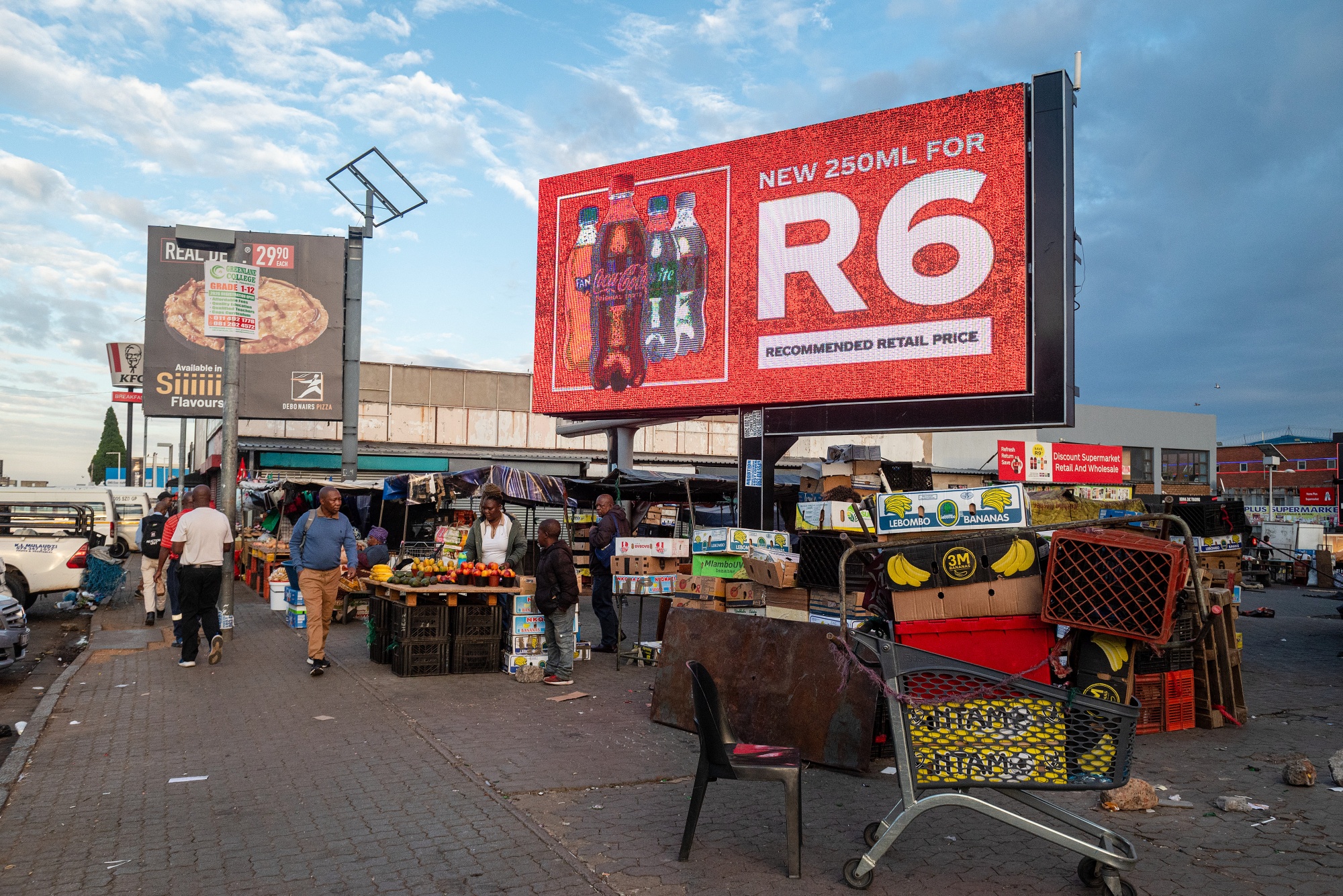 A Coca Cola Co. advertisement in Soweto near Johannesburg, South Africa, on Wednesday, Feb. 18, 2026. South Africa's unemployment rate dropped to the lowest level in more than five years in the fourth quarter, as the community and social services and construction sectors added workers. Photographer: Leon Sadiki/Bloomberg