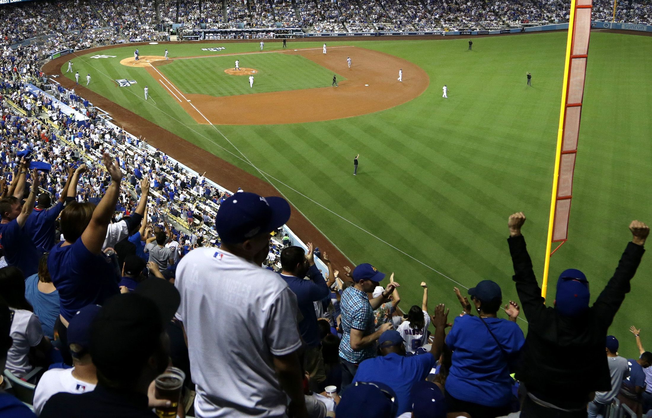 Chicago Cubs fans cheer in the fourth inning against the Los Angeles Dodgers in game four of the National League Championship Series at Dodger Stadium on Oct. 19, 2016 in Los Angeles, California.
