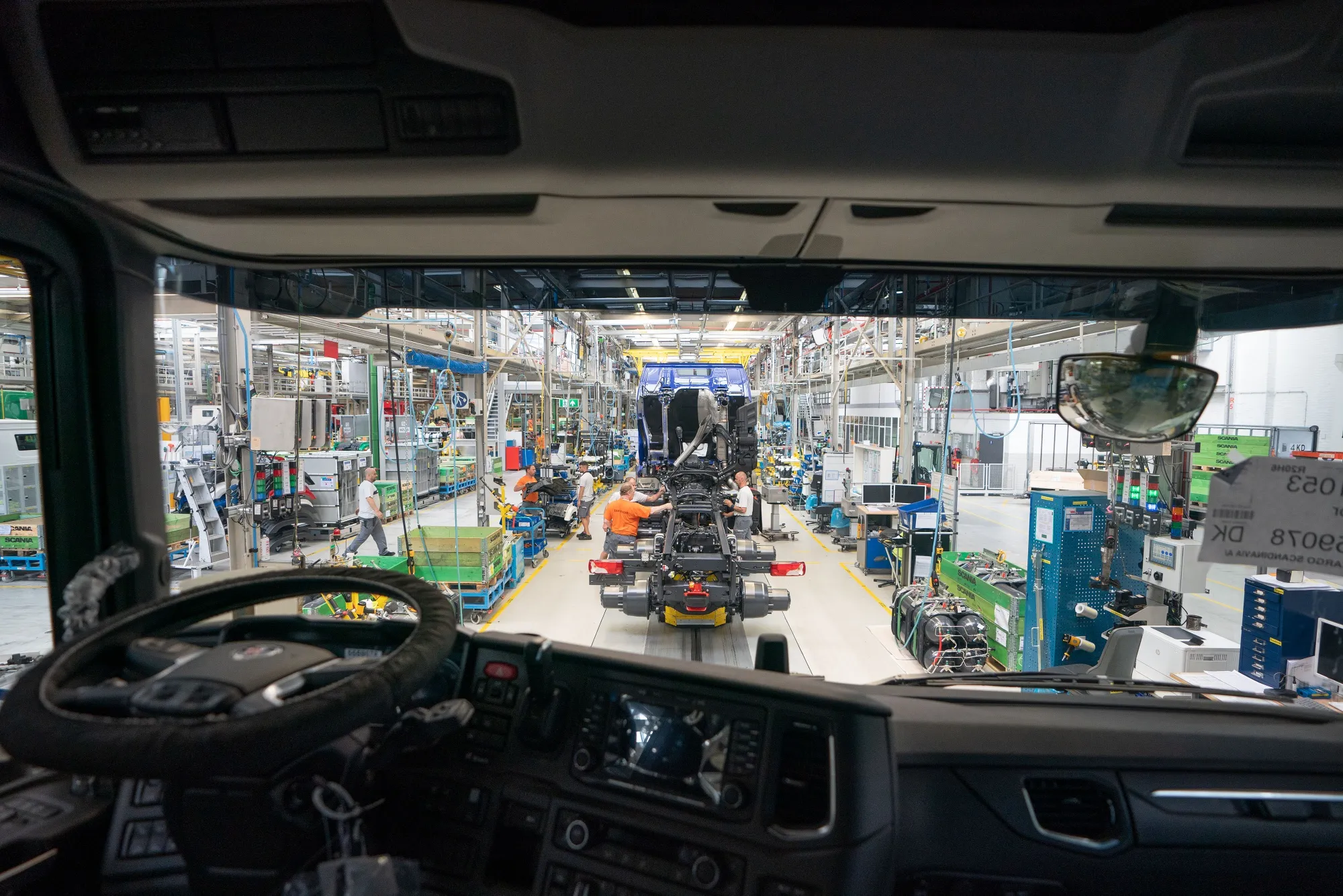 The chassis assembly line seen from the cabin of a Scania AB truck.