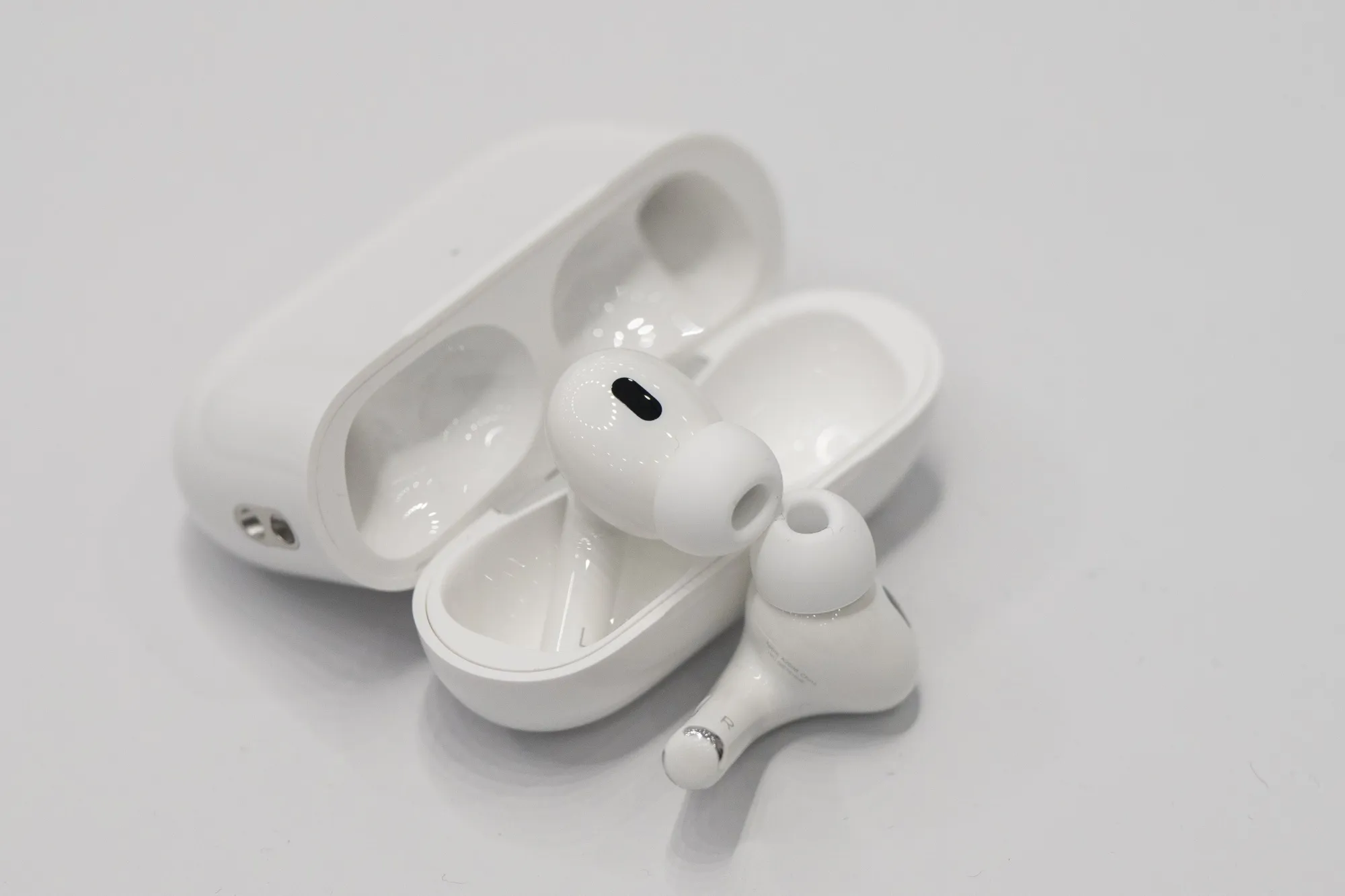 Apple AirPods Plans Hearing Test Body Temperature Cheaper Models USB C Bloomberg