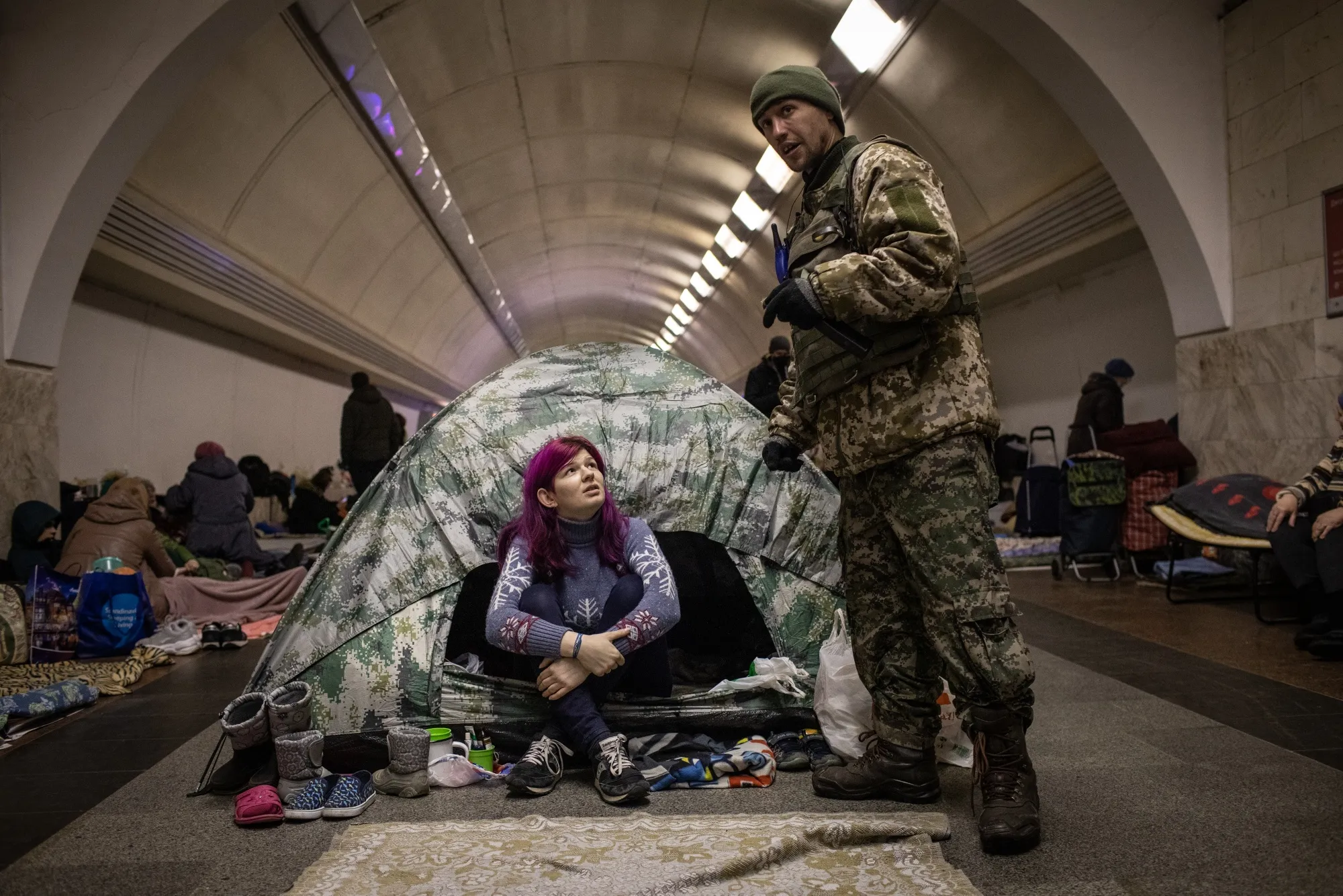 A Ukrainian soldier visits a relative&nbsp;in the lower level of a Kyiv metro station, on March 2.