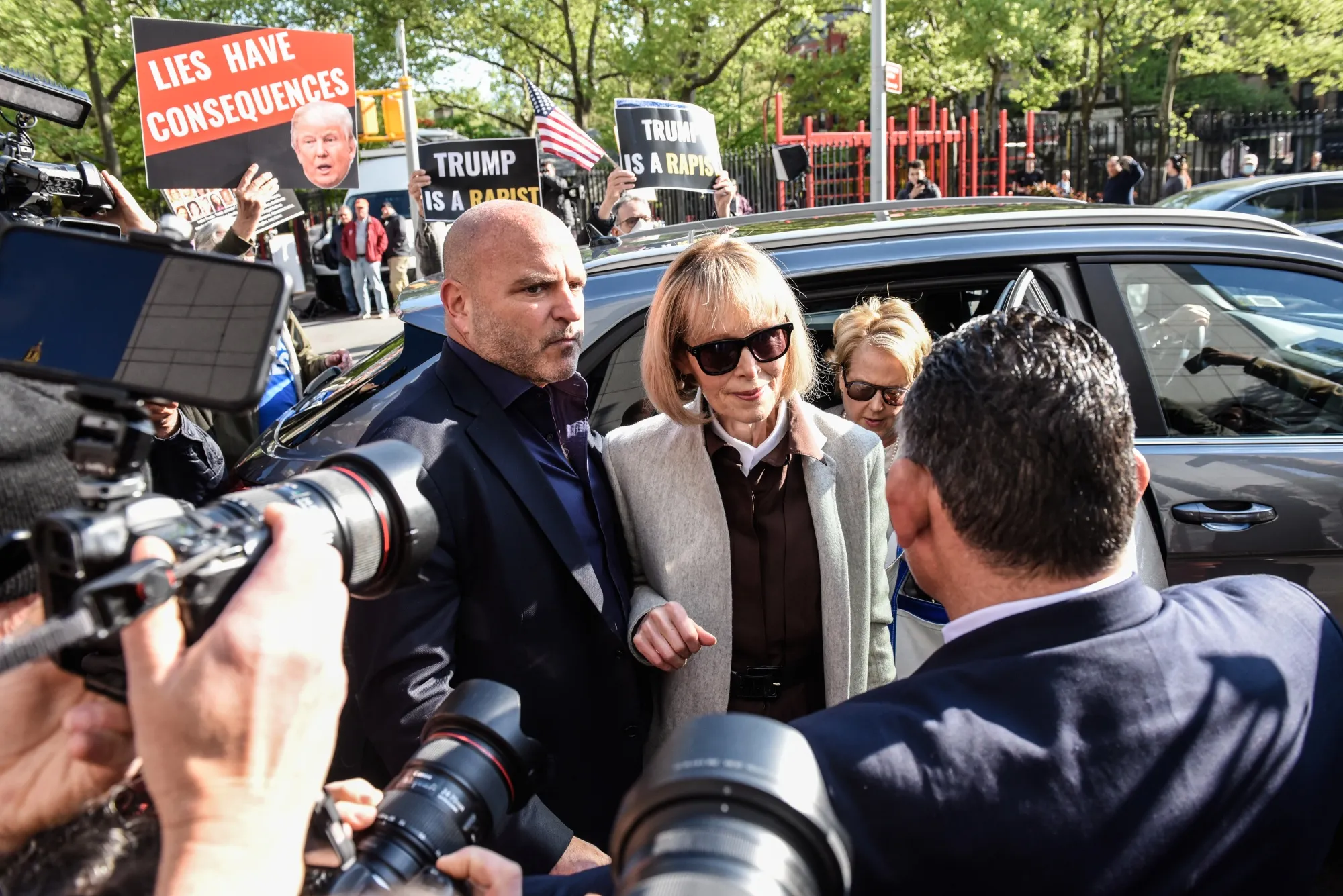 E. Jean Carroll, center, arrives to federal court in New York, on April 25.
