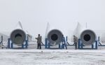 Employees inspect wind turbine parts at a factory in Jiuquan, Gansu province, China.