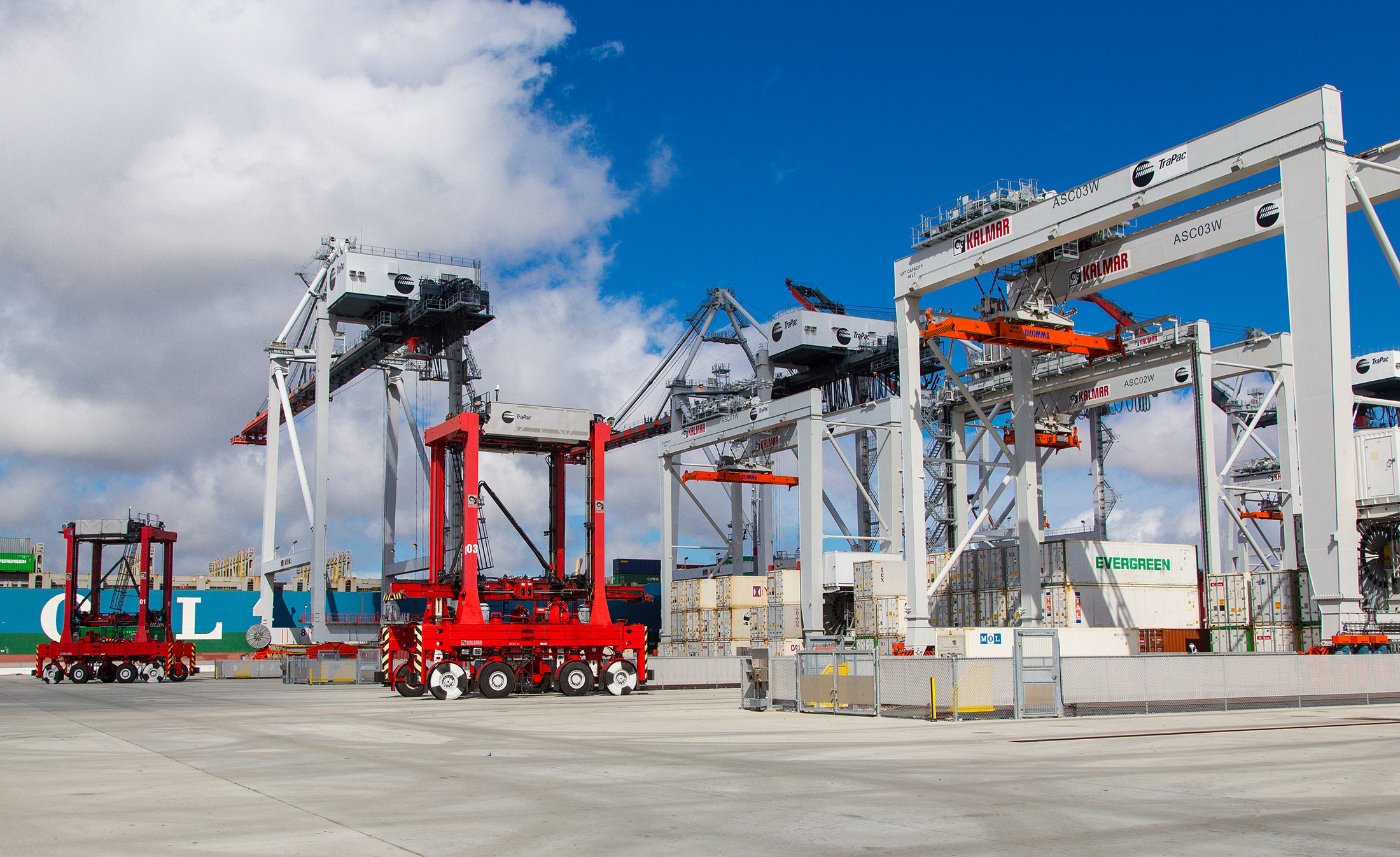 AutoStrads pick-up shipping containers and deliver them to  automated stacking cranes at the TraPac terminal in the Port of Los Angeles.

