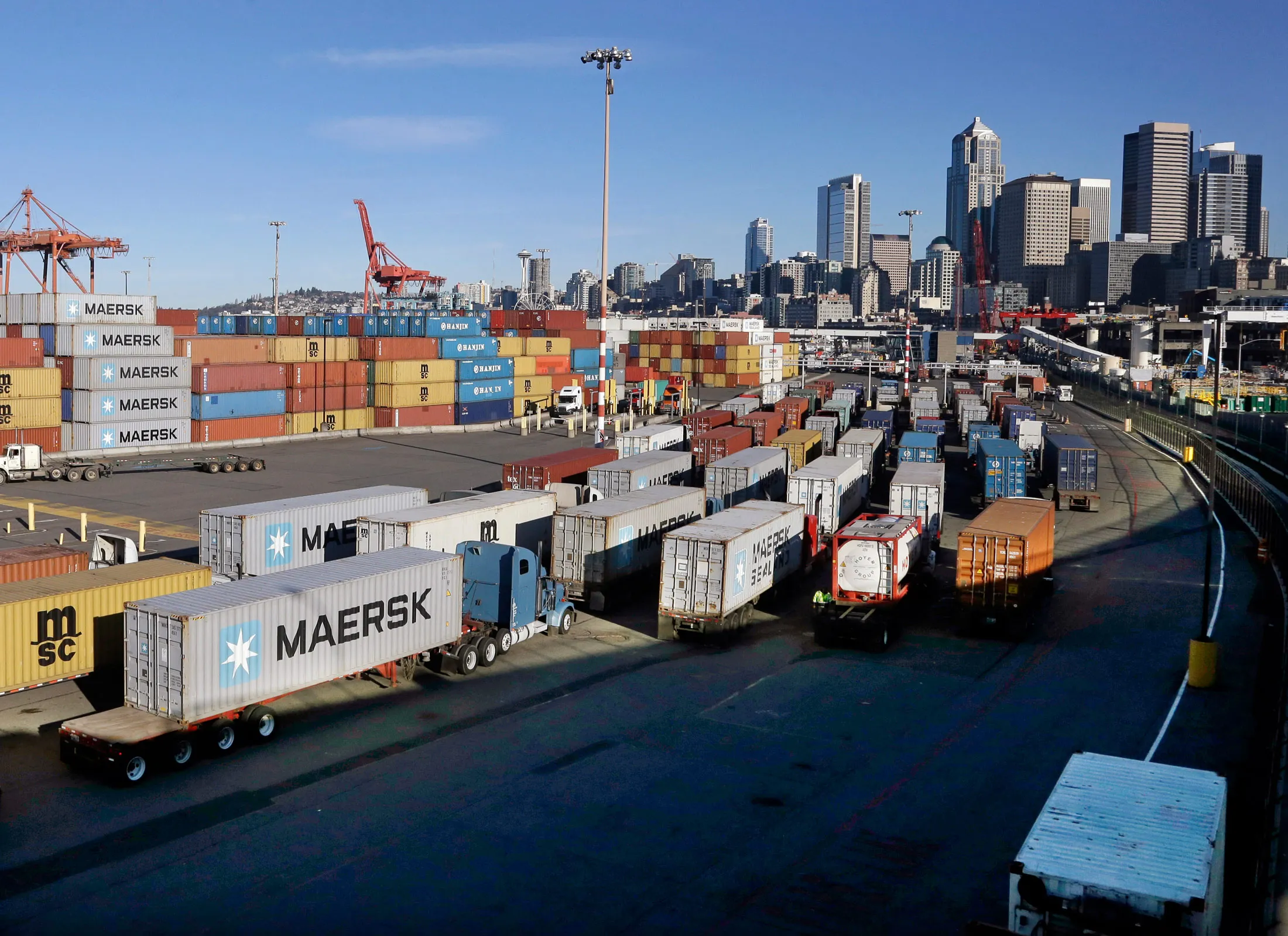 Loaded container trucks line up at a gate at the Port of Seattle on Feb. 17
