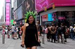 A tourist waits for a picture at Times Square&nbsp;on July 17, 2022, in New York. The summer tourism season is in full swing across New York, despite inflation and gas prices.
