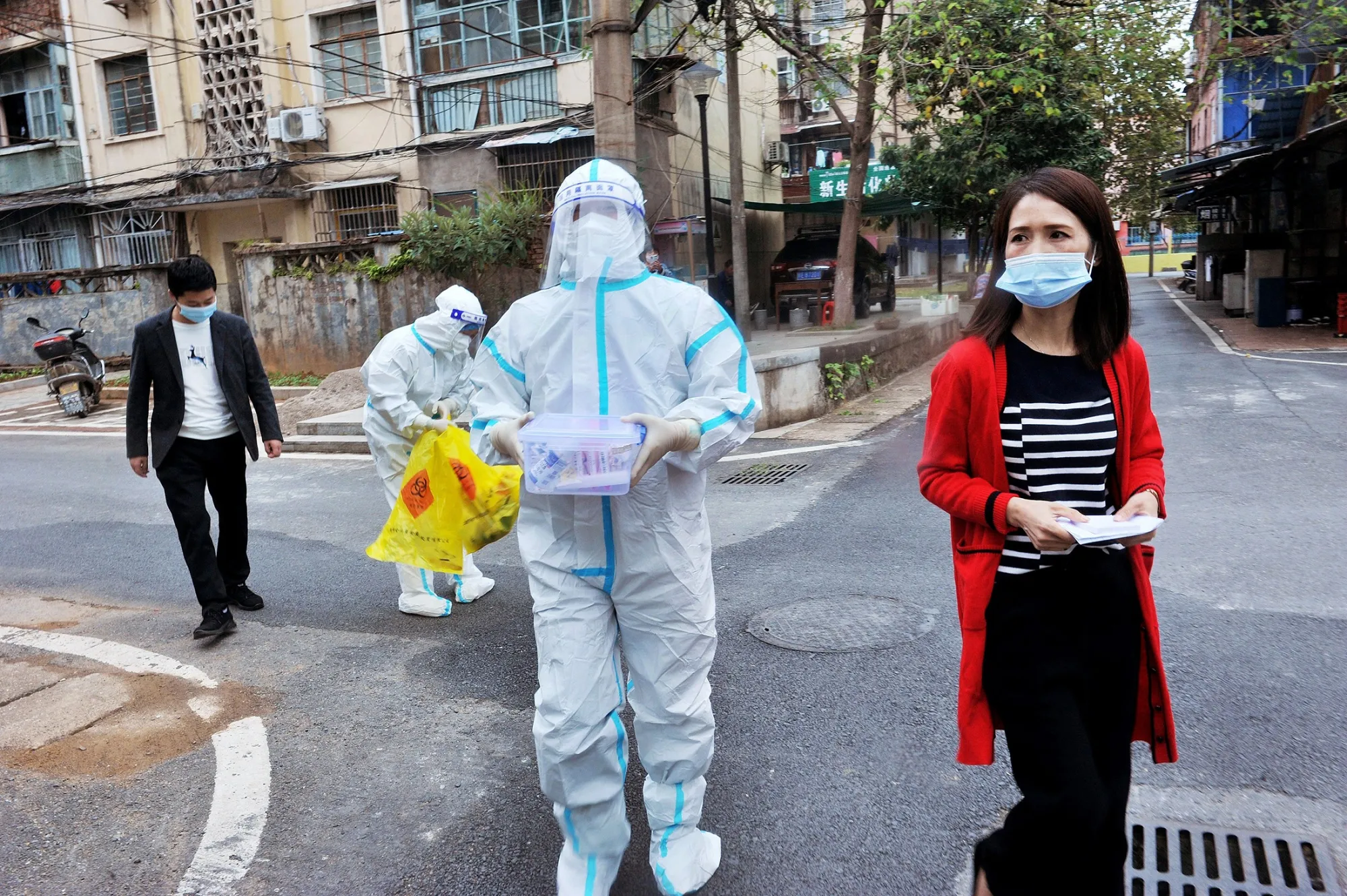 Officials and medical workers prepare to conduct Covid-19 coronavirus tests on residents isolating at home following the recent coronavirus outbreak in Dexing, in China's central Jiangxi province, on Nov. 3.&nbsp;