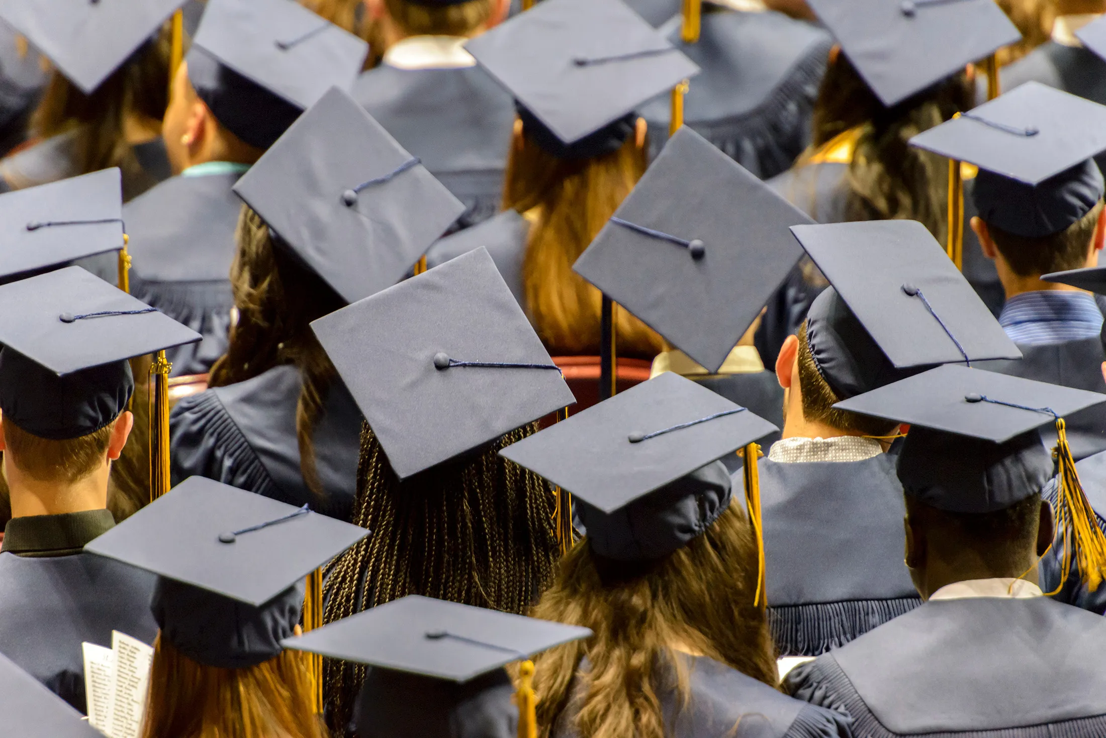 A group of graduating student wearing  caps.