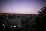 A home stands at dusk in Los Altos Hills, California, U.S., on Monday, Feb. 10, 2020. The richest communities in the U.S. continue to get richer. This year, in order to make the top 100, a neighborhood needed an average household income of $220,000 -- up from $209,000 last year.