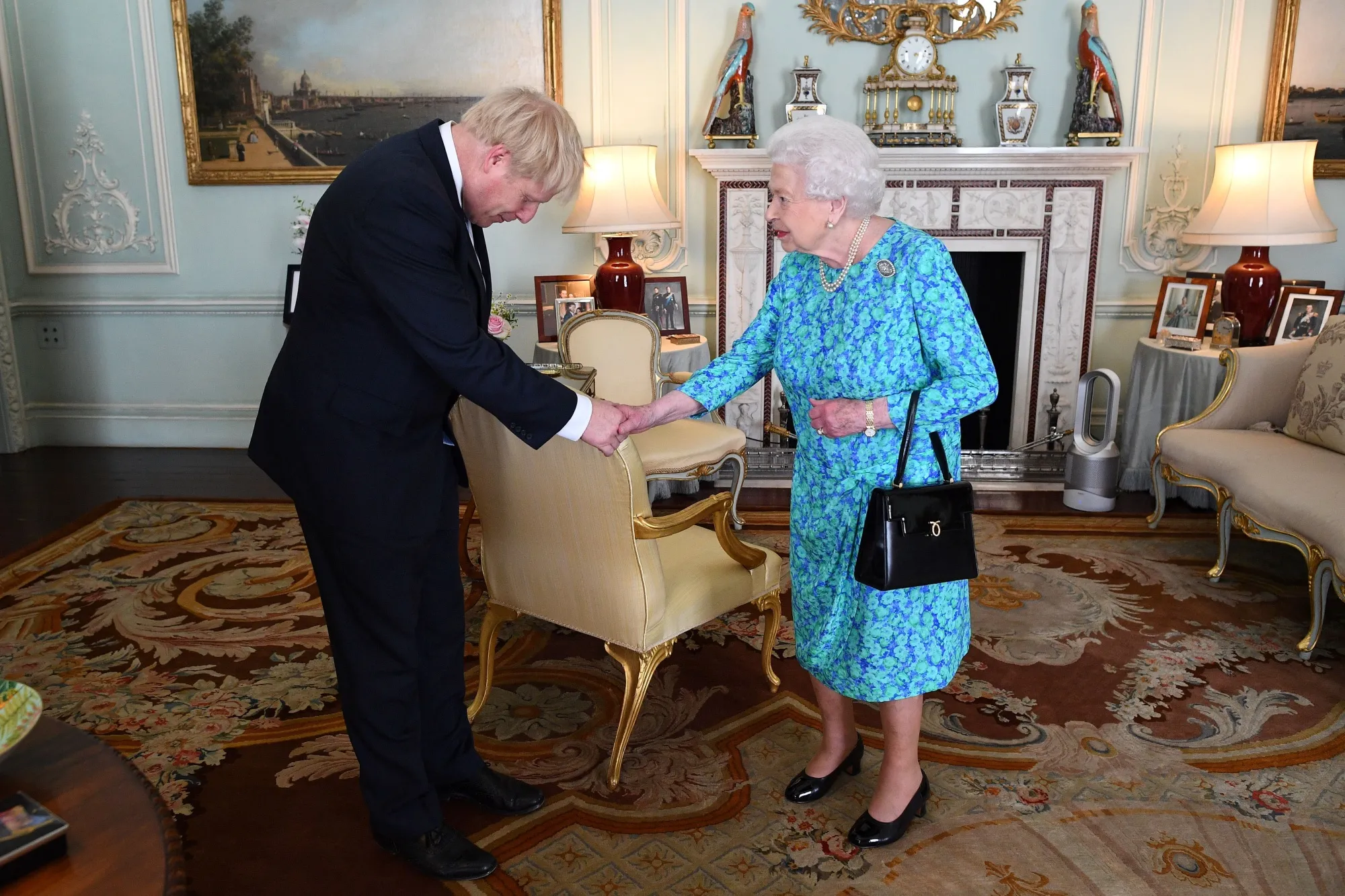 Queen Elizabeth II welcomes Boris Johnson during an audience in Buckingham Palace, London on July 24.