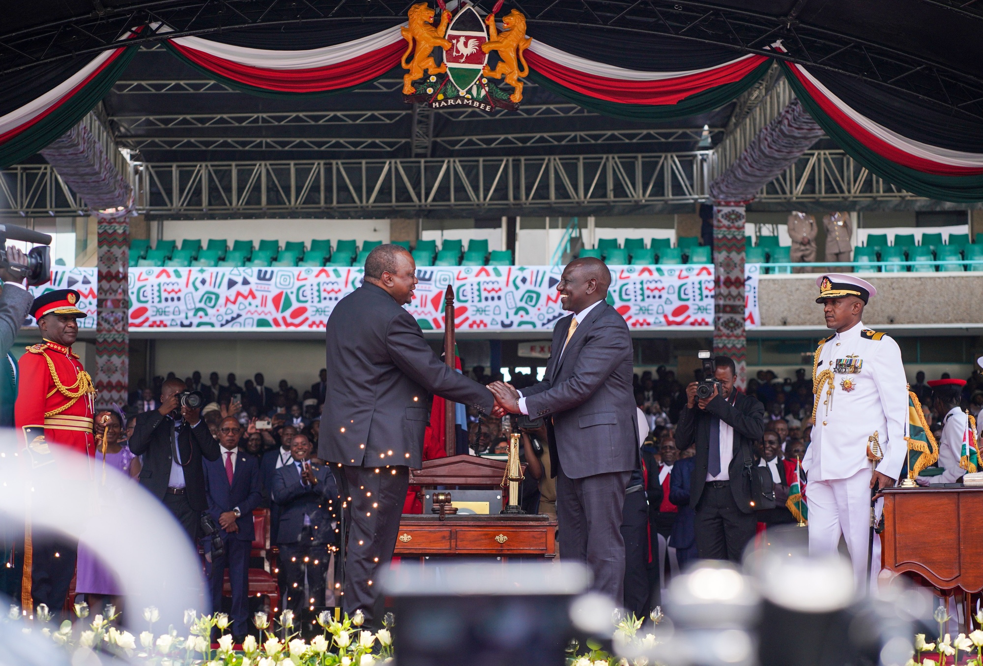 President William Ruto, right, shakes hands with Uhuru Kenyatta during his inauguration ceremony in Nairobi, Kenya, on Sept. 13.