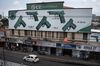 A billboard with guns decorates the front facade of a gun store in Guatemala City.