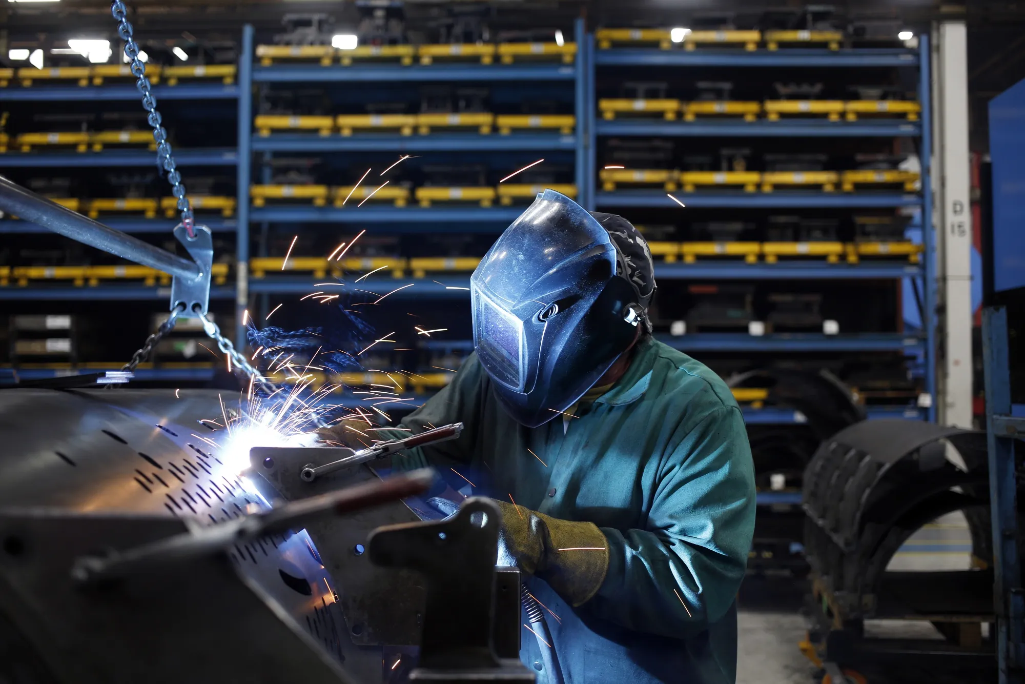 A worker welds at an assembly plant in New Holland, Pennsylvania U.S.&nbsp;