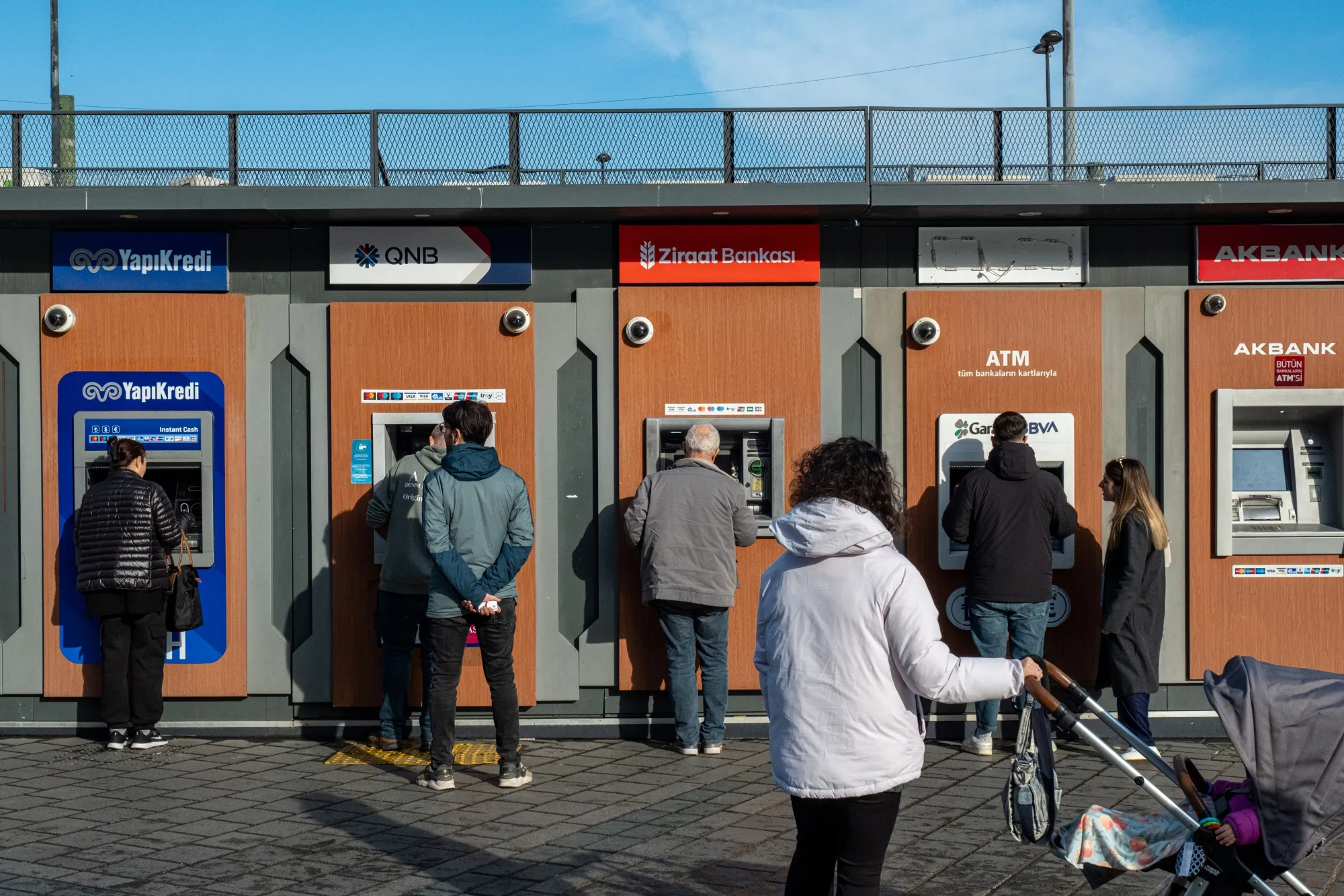 Customers use automated teller machines&nbsp;in Istanbul.&nbsp;