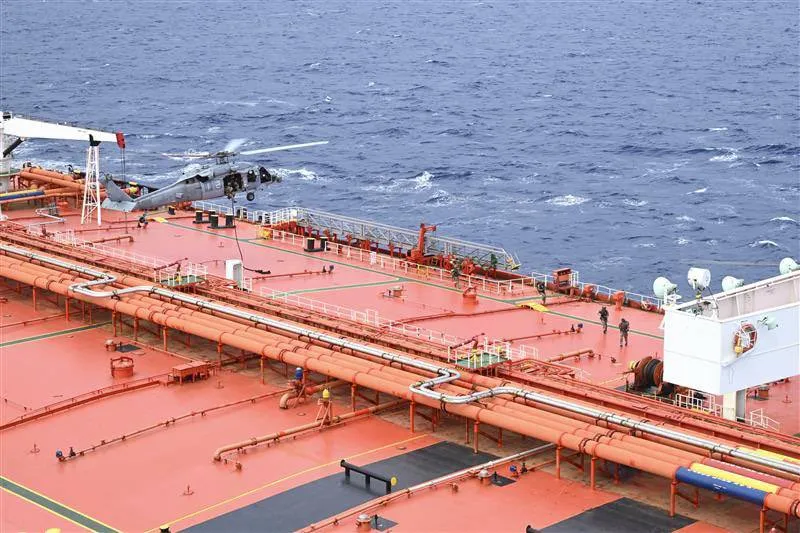 US forces conduct a “maritime interdiction and right-of-visit boarding” of the Tifani tanker, in an image released by the US Department of Defense on April 21.